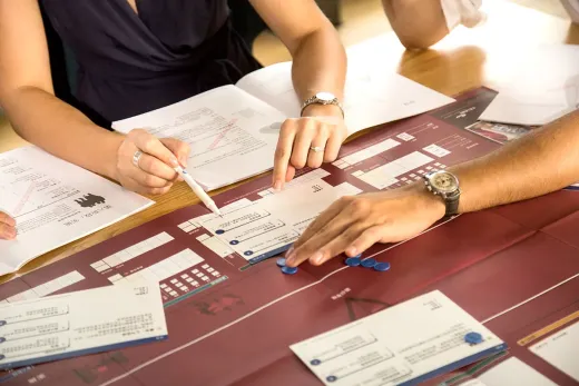 Project Management Simulation CELEMI Cayenne™ Close-up of moving tokens on physical board