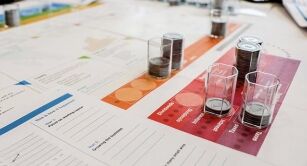 Close-up of physical board of CELEMI Apples and Oranges™ business simulation
