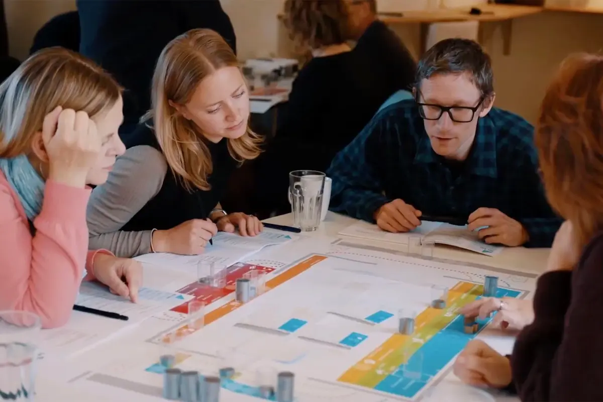 People playing Celemi Apples & Oranges simulation